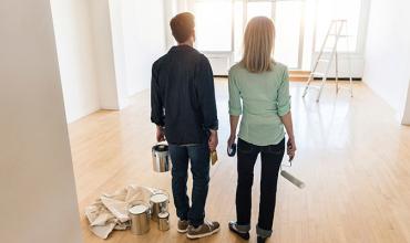 Homeowners painting a room