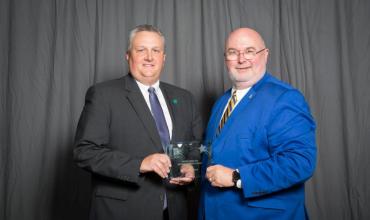 Bill Hobbs and Scott Farmer accepting award