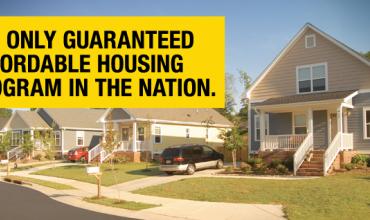 Photo of houses with text over it reading "the only guaranteed affordable housing program in the nation"