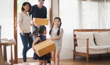 Family running into a home