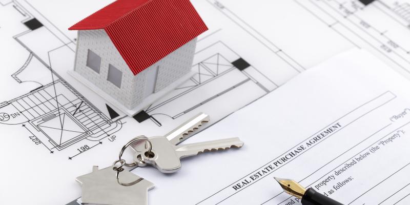 First-Time Home Buyers, Military Vets Eligible for $8,000 in Down Payment Help toy house on a mortgage contract