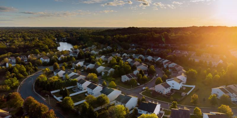 Aerial view of a suburban neighborhood at dusk