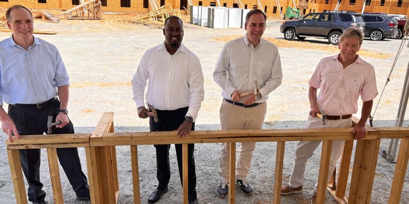 A group of people standing in a construction site