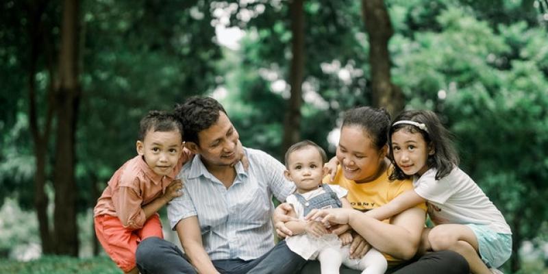 Family sitting on grass