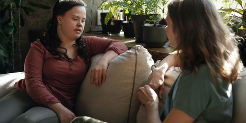 Two women sitting on a couch