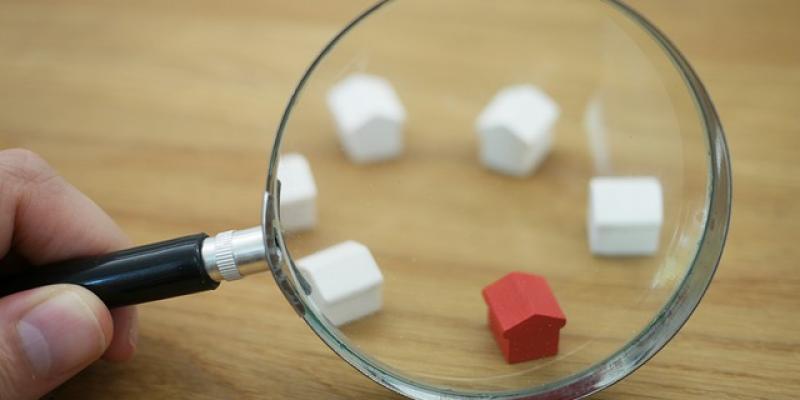 magnifying glass looking at a group of houses